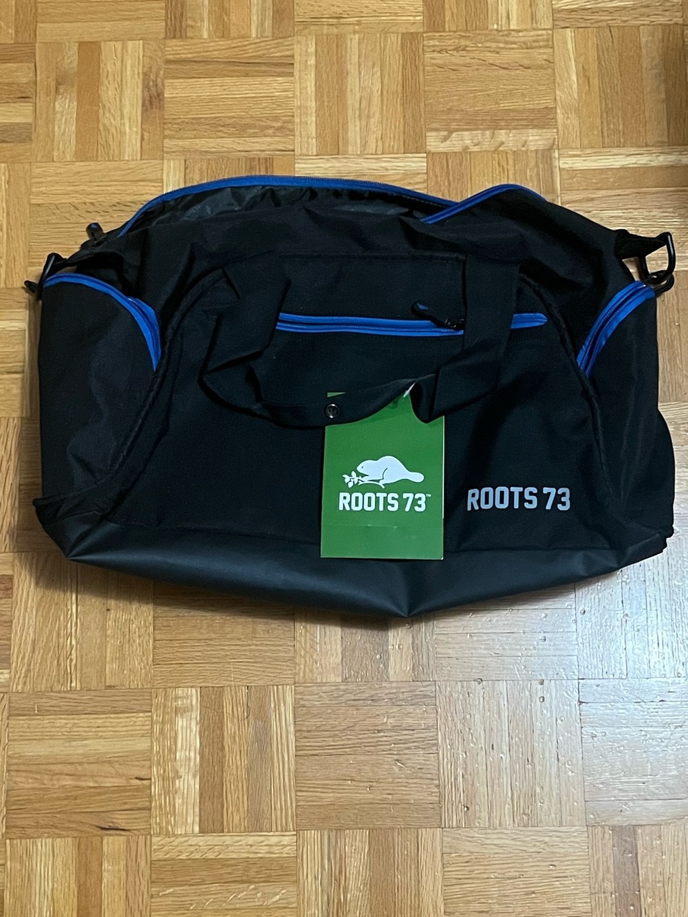NWT Roots Black Duffel Bag with Blue Trim